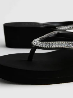 Flipflops mit Keilabsatz und Strasssteinen