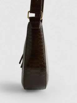 Kunstleder-Schultertasche mit Trensenschnalle