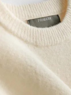 Pullover mit Brosche