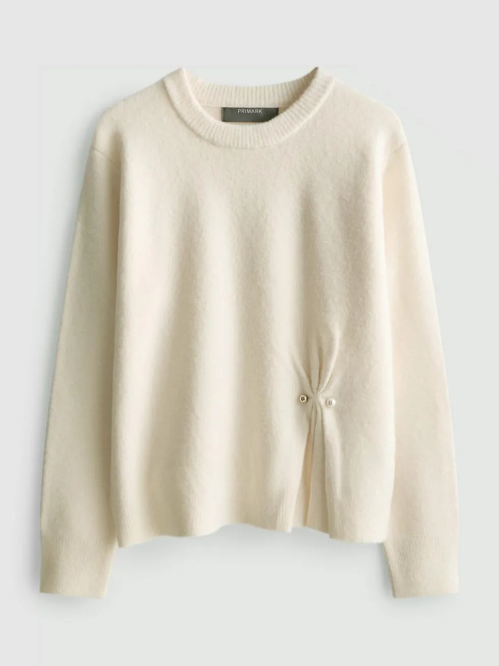Pullover mit Brosche