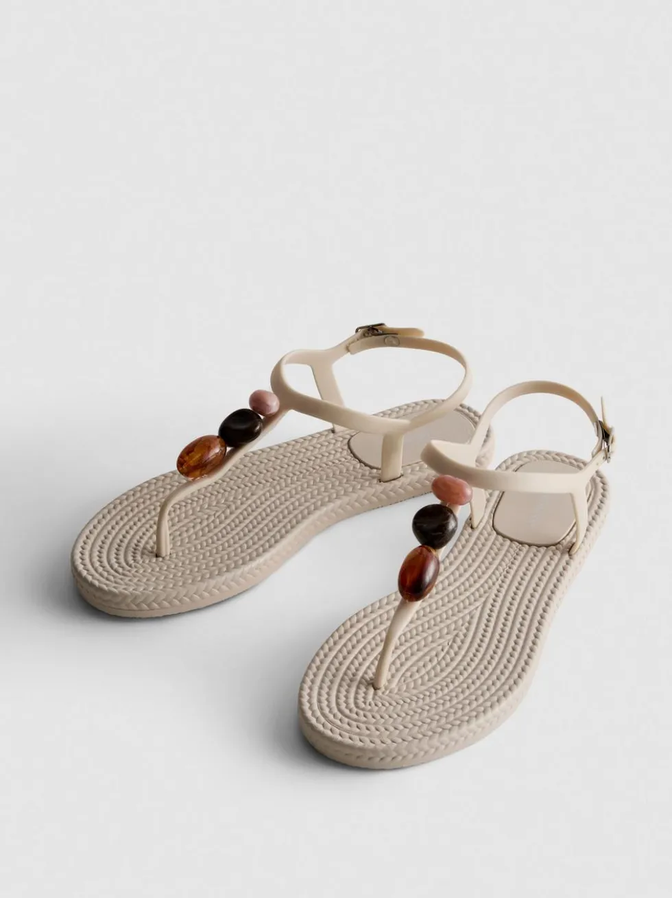 Zehenstegsandalen mit Perlen